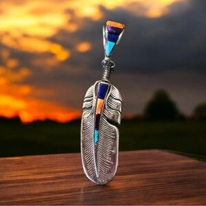 Vintage Christin Wolf feather stone inlay sterling silver pendant. 30+ years old